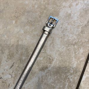 Silver patent leather belt